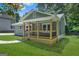 Attractive home featuring a cozy front porch with wooden columns and a lush green yard at 1675 White Oak Way, Decatur, GA 30032