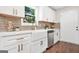 Beautiful kitchen with white cabinets, stainless steel appliances, and modern sink and faucet at 1675 White Oak Way, Decatur, GA 30032