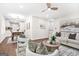 Open-concept living room connected to the dining area, featuring modern decor and hardwood floors at 1675 White Oak Way, Decatur, GA 30032