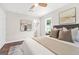 Comfortable bedroom with neutral décor, modern ceiling fan, and vinyl flooring at 1675 White Oak Way, Decatur, GA 30032