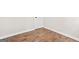 Unfurnished room with modern baseboards, fresh paint, and vinyl flooring at 1675 White Oak Way, Decatur, GA 30032