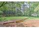 Spacious backyard showcasing mature trees, lush greenery, and natural landscape elements at 4920 Tremont Ne Dr, Marietta, GA 30066
