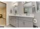 Bright bathroom featuring double sinks, gray shaker cabinets and modern lighting at 4920 Tremont Ne Dr, Marietta, GA 30066