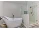 Luxurious bathroom features soaking tub and glass enclosed shower with modern finishes at 4920 Tremont Ne Dr, Marietta, GA 30066