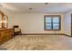 A spacious bedroom with carpet, natural light from a window, and a wooden dresser at 4920 Tremont Ne Dr, Marietta, GA 30066