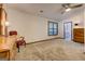 Spacious bedroom with neutral carpet, ceiling fan, adjacent bathroom and walk in closet at 4920 Tremont Ne Dr, Marietta, GA 30066