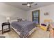 Bedroom featuring a bed, ceiling fan, window and furnishings at 4920 Tremont Ne Dr, Marietta, GA 30066