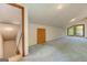 Bright bonus room featuring high ceilings, neutral walls and access to an unfinished staircase at 4920 Tremont Ne Dr, Marietta, GA 30066