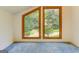 Large bonus room showcasing a beautiful view of the outdoors with neutral walls, and wood trim at 4920 Tremont Ne Dr, Marietta, GA 30066