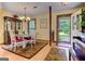 Inviting dining room featuring a decorative chandelier, oriental rug, and classic china cabinet at 4920 Tremont Ne Dr, Marietta, GA 30066