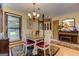 Cozy dining room showcases a classic hutch, piano, and natural light at 4920 Tremont Ne Dr, Marietta, GA 30066