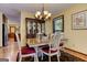 Bright dining area with a vintage hutch, chandelier, and seating for four at 4920 Tremont Ne Dr, Marietta, GA 30066