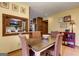 A dining room area with a window to the kitchen, and a dining table with four chairs at 4920 Tremont Ne Dr, Marietta, GA 30066