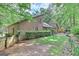Beautiful property showing the side and rear exterior, lush landscaping and mature trees at 4920 Tremont Ne Dr, Marietta, GA 30066