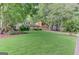 Charming two-story home with a well-manicured lawn, mature trees, and an attached two-car garage at 4920 Tremont Ne Dr, Marietta, GA 30066