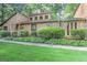 Close-up view of a charming two-story home with stone accents and a well-manicured lawn at 4920 Tremont Ne Dr, Marietta, GA 30066