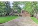 Charming two-story home with a well-manicured lawn, mature trees, and an attached two-car garage at 4920 Tremont Ne Dr, Marietta, GA 30066