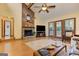 Charming living room features a stone fireplace, wood accents, and bright windows at 4920 Tremont Ne Dr, Marietta, GA 30066