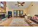 Spacious living room with a stone fireplace, wood floors, and French doors at 4920 Tremont Ne Dr, Marietta, GA 30066