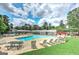 Community pool featuring lounge chairs, picnic tables, and well-maintained landscaping, ideal for relaxation at 4920 Tremont Ne Dr, Marietta, GA 30066
