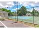 Community tennis court for recreation and exercise, set against a backdrop of mature trees at 4920 Tremont Ne Dr, Marietta, GA 30066