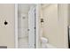 View of bathroom area with toilet and a walk-in closet featuring shelving at 2821 Amhurst Nw Way, Kennesaw, GA 30144