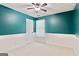 Bedroom showcasing wainscoting, a window, and neutral carpet at 2821 Amhurst Nw Way, Kennesaw, GA 30144