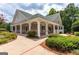 Charming clubhouse with rocking chairs on the porch and beautiful landscaping at 2821 Amhurst Nw Way, Kennesaw, GA 30144