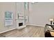 Bright living room with hardwood floors, fireplace and large windows at 2821 Amhurst Nw Way, Kennesaw, GA 30144