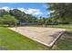 Exterior shot of a sand volleyball court surrounded by grass at 2821 Amhurst Nw Way, Kennesaw, GA 30144