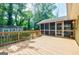 Spacious back deck for outdoor entertaining with a screened-in porch and a view of the backyard at 2985 Westbury Dr, Decatur, GA 30033