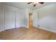 Bright bedroom with light wood floors, ceiling fan, and ensuite bathroom access at 2985 Westbury Dr, Decatur, GA 30033