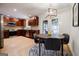 Eat-in kitchen featuring hardwood floors, lots of natural light and a modern chandelier at 2985 Westbury Dr, Decatur, GA 30033