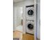 Convenient laundry closet featuring stacked washer and dryer, adjacent to the bathroom at 2985 Westbury Dr, Decatur, GA 30033
