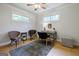 Comfortable home office with hardwood floors, a modern desk, and ample natural light at 2985 Westbury Dr, Decatur, GA 30033
