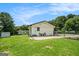 Spacious backyard featuring a well-maintained lawn, patio area, and mature trees, perfect for outdoor enjoyment at 4020 Ester Sw Dr, Atlanta, GA 30331