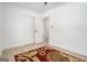 Bedroom with wood floors and a modern rug, providing a cozy and stylish atmosphere at 4020 Ester Sw Dr, Atlanta, GA 30331