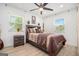 Cozy bedroom with lots of natural light, neutral paint and a ceiling fan at 4020 Ester Sw Dr, Atlanta, GA 30331