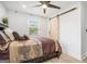 Comfortable bedroom with modern finishes, including a ceiling fan and updated flooring at 4020 Ester Sw Dr, Atlanta, GA 30331