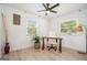 Bright home office with wood floors, two windows, ceiling fan, stylish decor, and a comfortable desk and chair at 4020 Ester Sw Dr, Atlanta, GA 30331
