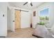 Bright home office with a wood desk, barn door, wood floors, and stylish decor at 4020 Ester Sw Dr, Atlanta, GA 30331