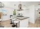 Kitchen island featuring granite countertops, a cooktop, seating, and pendant lighting at 4020 Ester Sw Dr, Atlanta, GA 30331