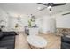 Open-concept living space features a kitchen island with bar seating and comfortable seating area at 4020 Ester Sw Dr, Atlanta, GA 30331