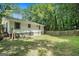 Backyard view featuring a wooden fence and a home with light siding at 114 Howell Dr, Atlanta, GA 30331