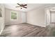 Inviting living room showcasing stylish wood-look floors, natural light, and a ceiling fan at 114 Howell Dr, Atlanta, GA 30331