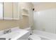 Cozy bathroom with tiled shower, white vanity, and practical shelving units at 9719 Dixon Industrial, Jonesboro, GA 30236