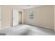 Cozy bedroom with neutral walls, plush carpeting, a closet, and a window for ample natural light at 9719 Dixon Industrial, Jonesboro, GA 30236