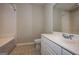 Bathroom featuring a white tub/shower combination, toilet, and vanity with a sink at 297 Collegiate Dr, Powder Springs, GA 30127