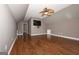 Large bonus room with hardwood floors, vaulted ceilings, and media installation, perfect for entertainment at 297 Collegiate Dr, Powder Springs, GA 30127