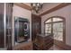 Large walk-in closet with island, vanity mirror and custom storage solutions at 297 Collegiate Dr, Powder Springs, GA 30127